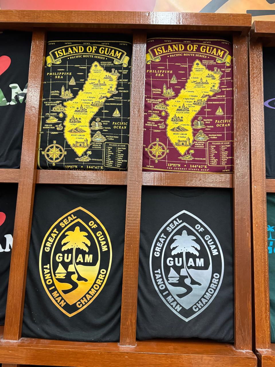 Guam Seal and Island of Guam map t-shirts on the shelf at Kmart Guam