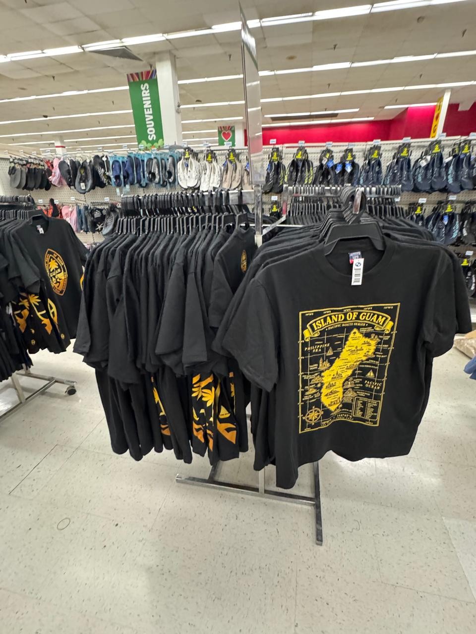 Black Island of Guam map t-shirts on the rack at Kmart Guam